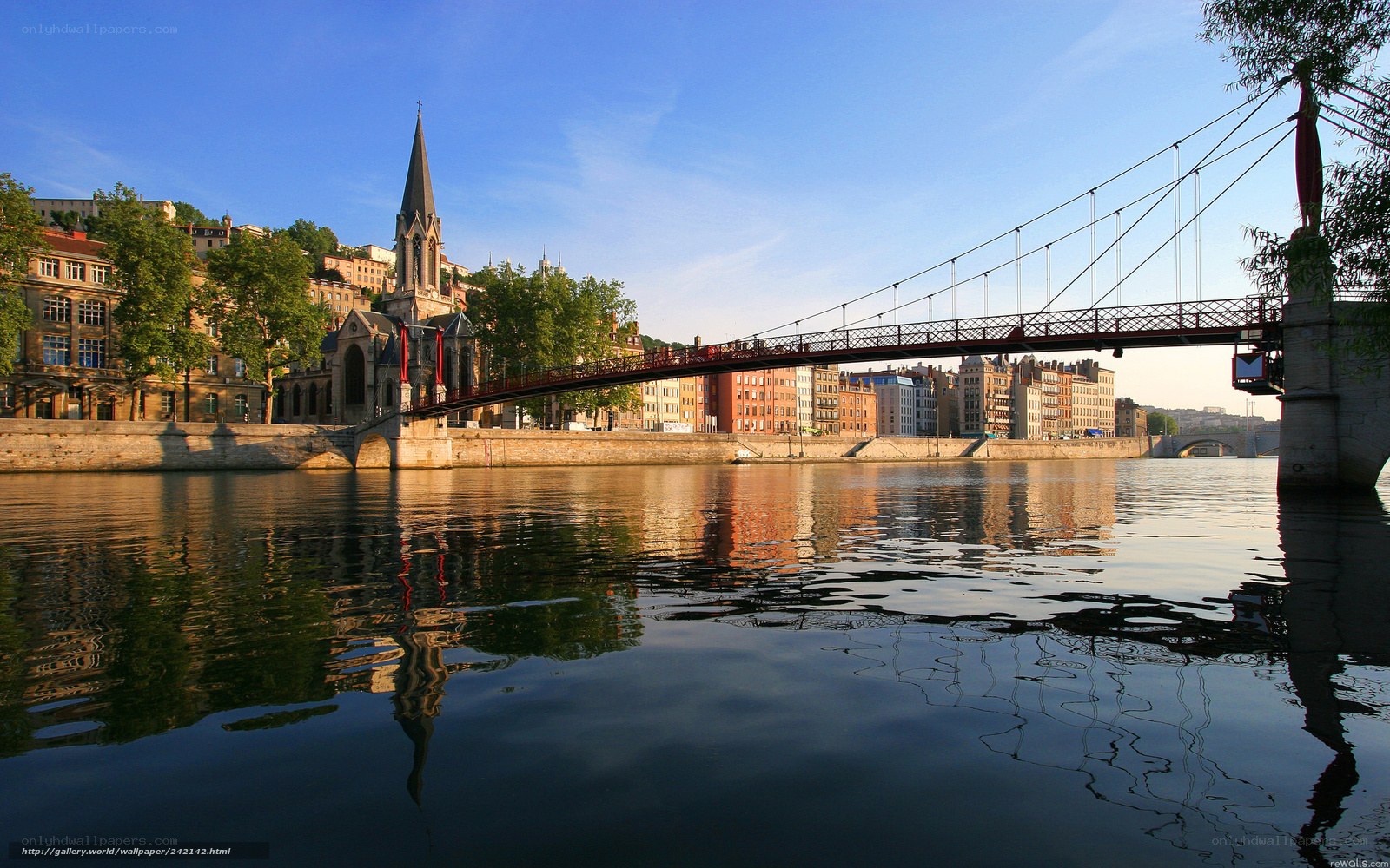 Bridge over river with church spire