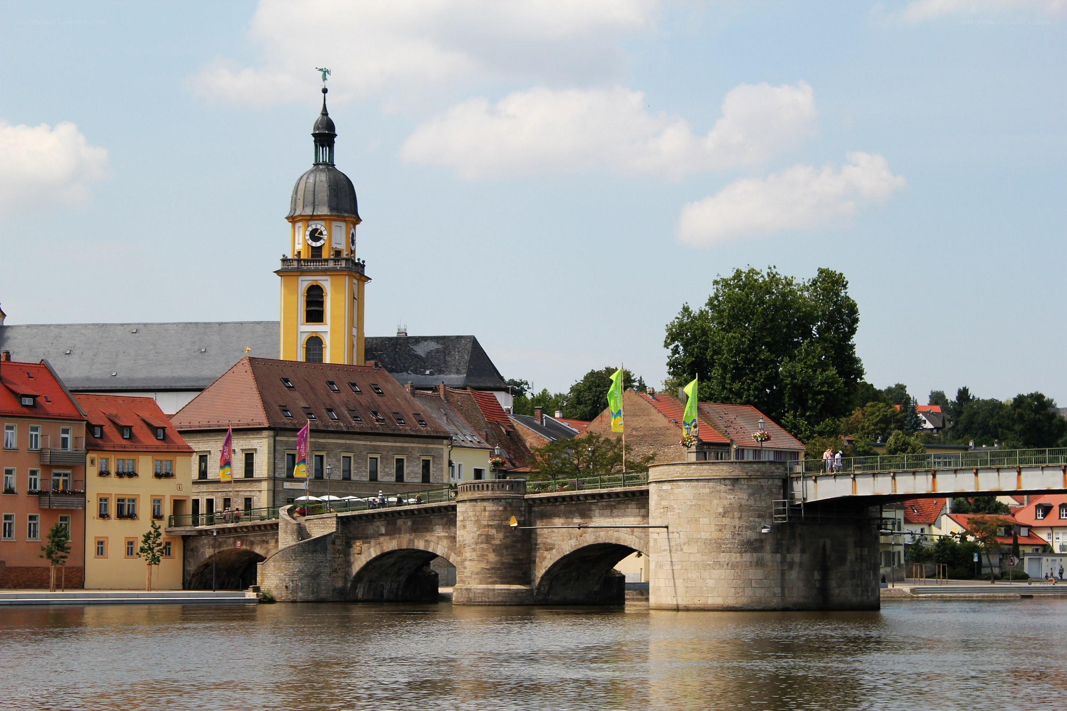 Bridge over river with clock tower