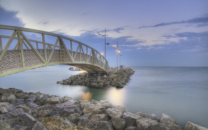 Bridge over the sea at dusk