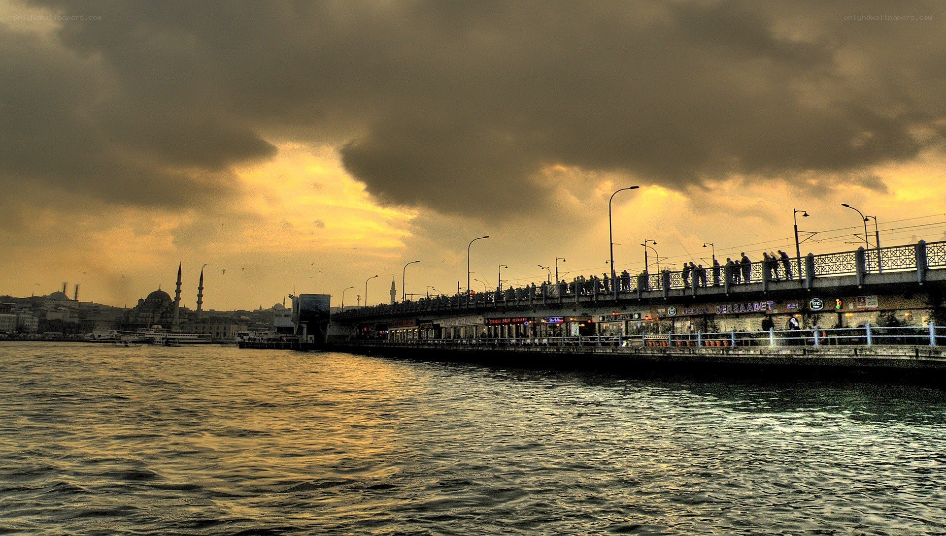 Bridge over water at sunset