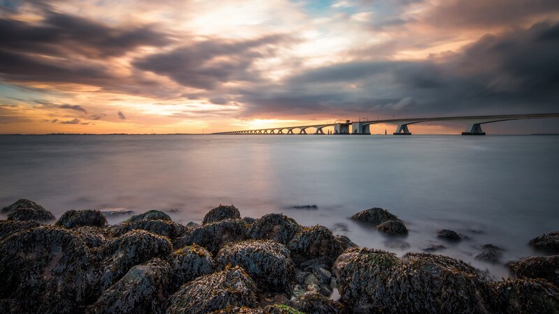 Bridge over Water at Sunset — Orange, Serene