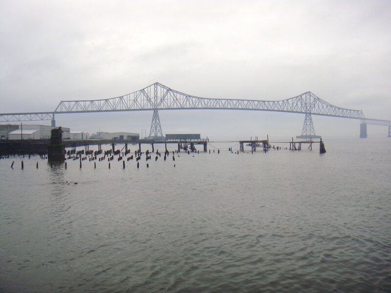 Bridge over water on a foggy day