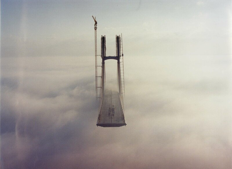 Bridge under construction in clouds