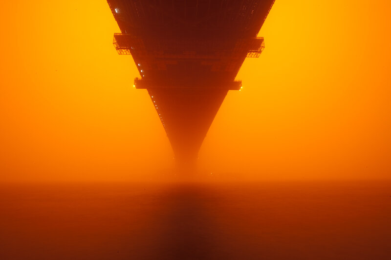 Bridge under orange sky