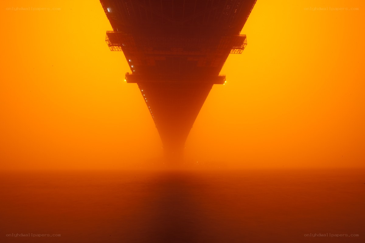 Bridge under orange sky