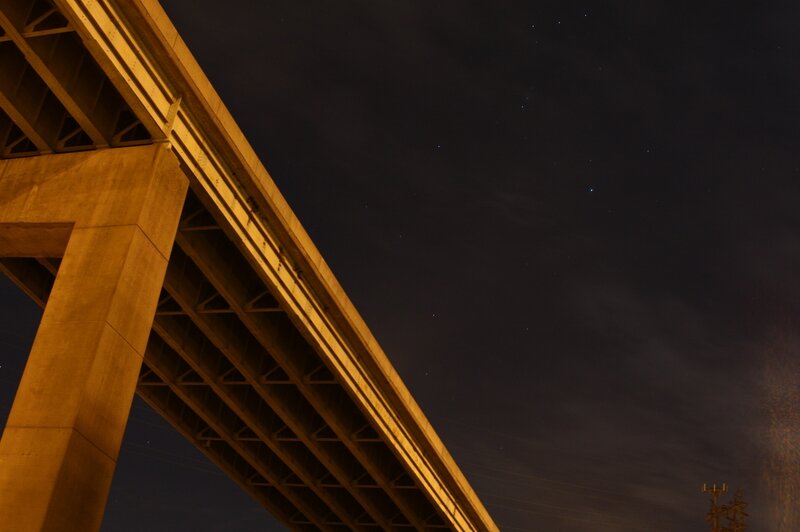 Bridge under starry night sky