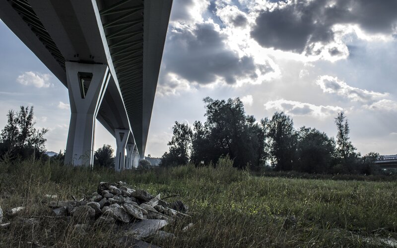 Bridge underpass with cloudy sky