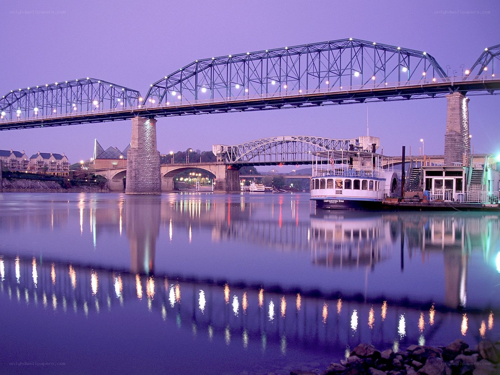bridges over a river at dusk