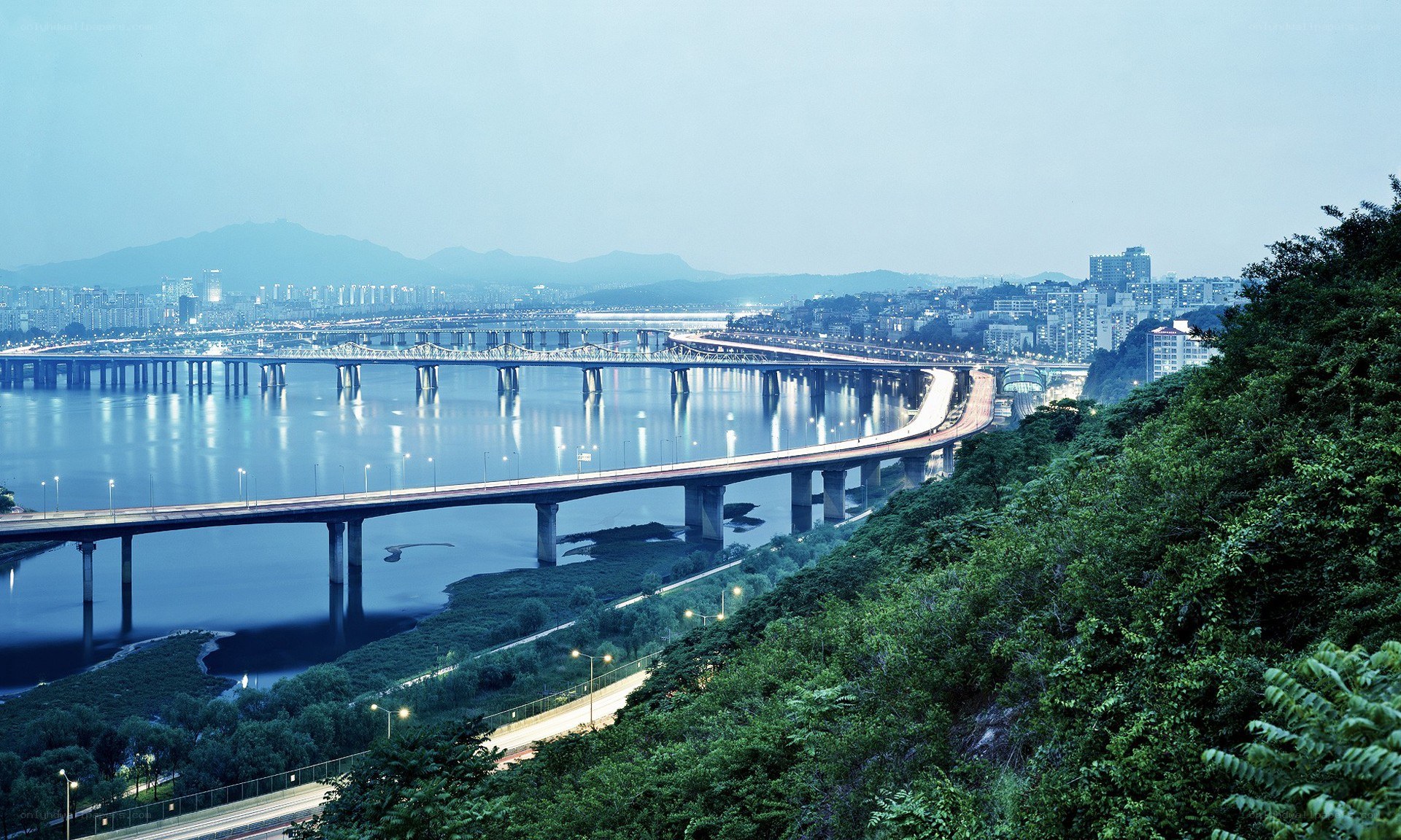 Bridges over a river at dusk