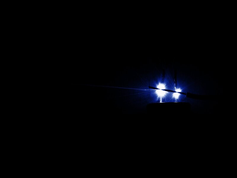 Bright blue light in darkness
