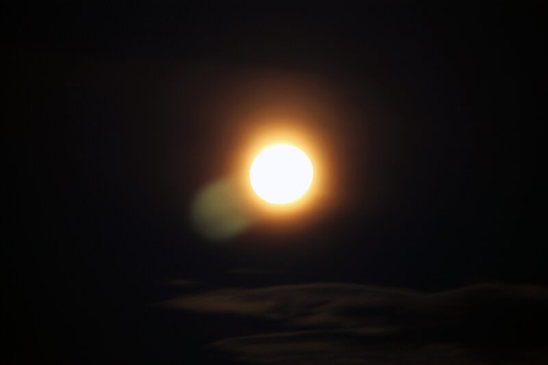 Bright moon in dark sky