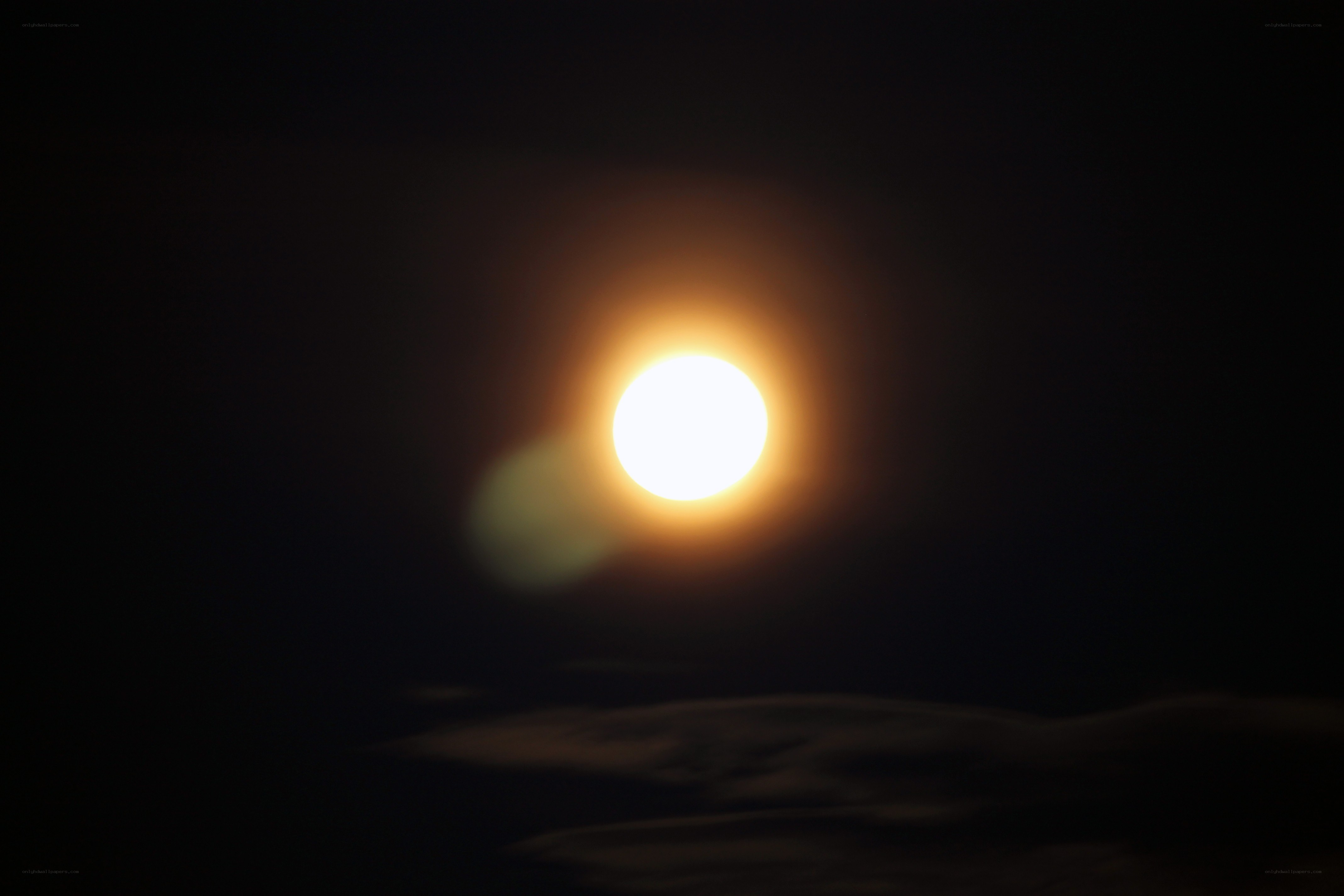 Bright moon in dark sky