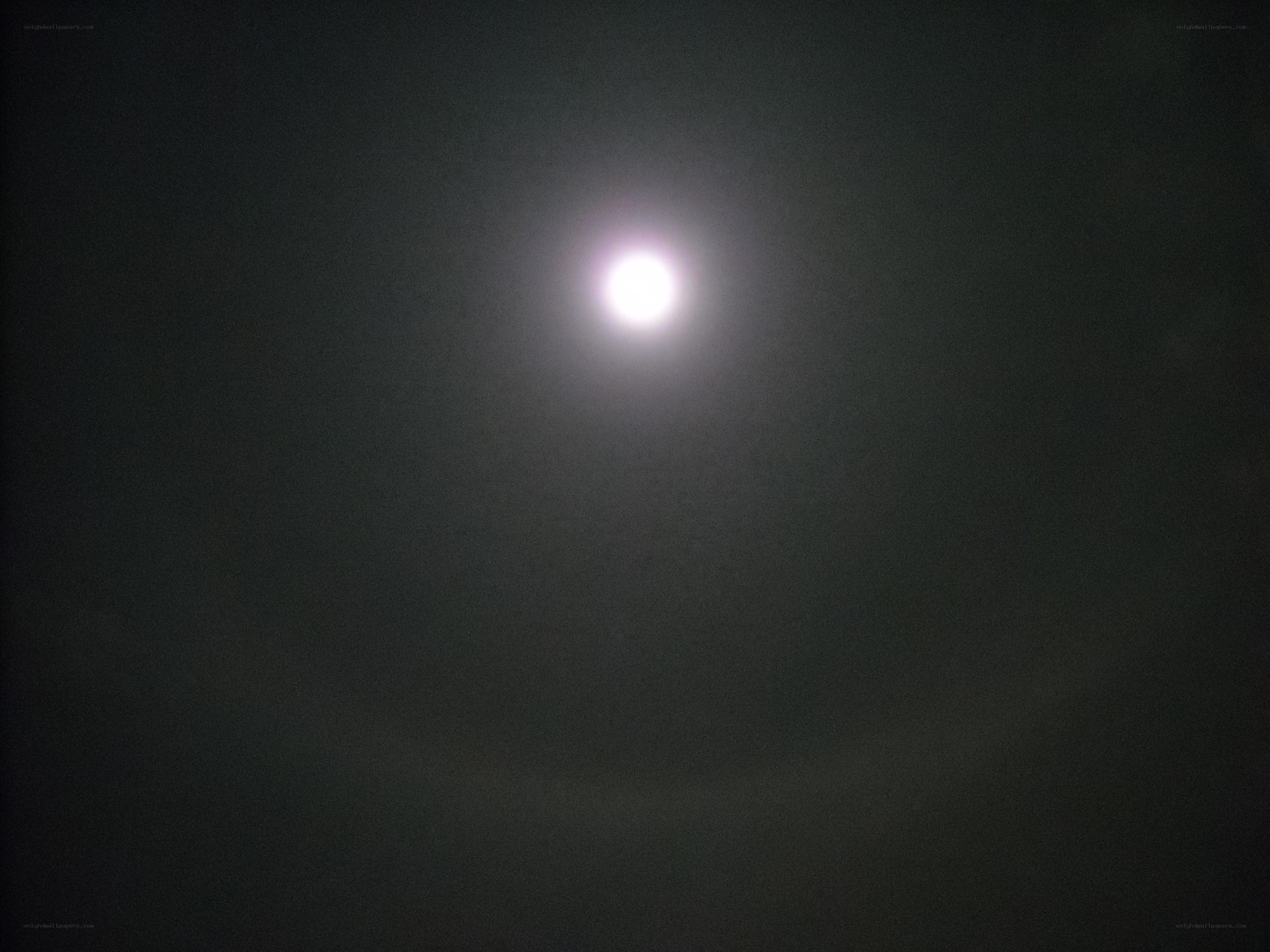 bright moon in dark sky