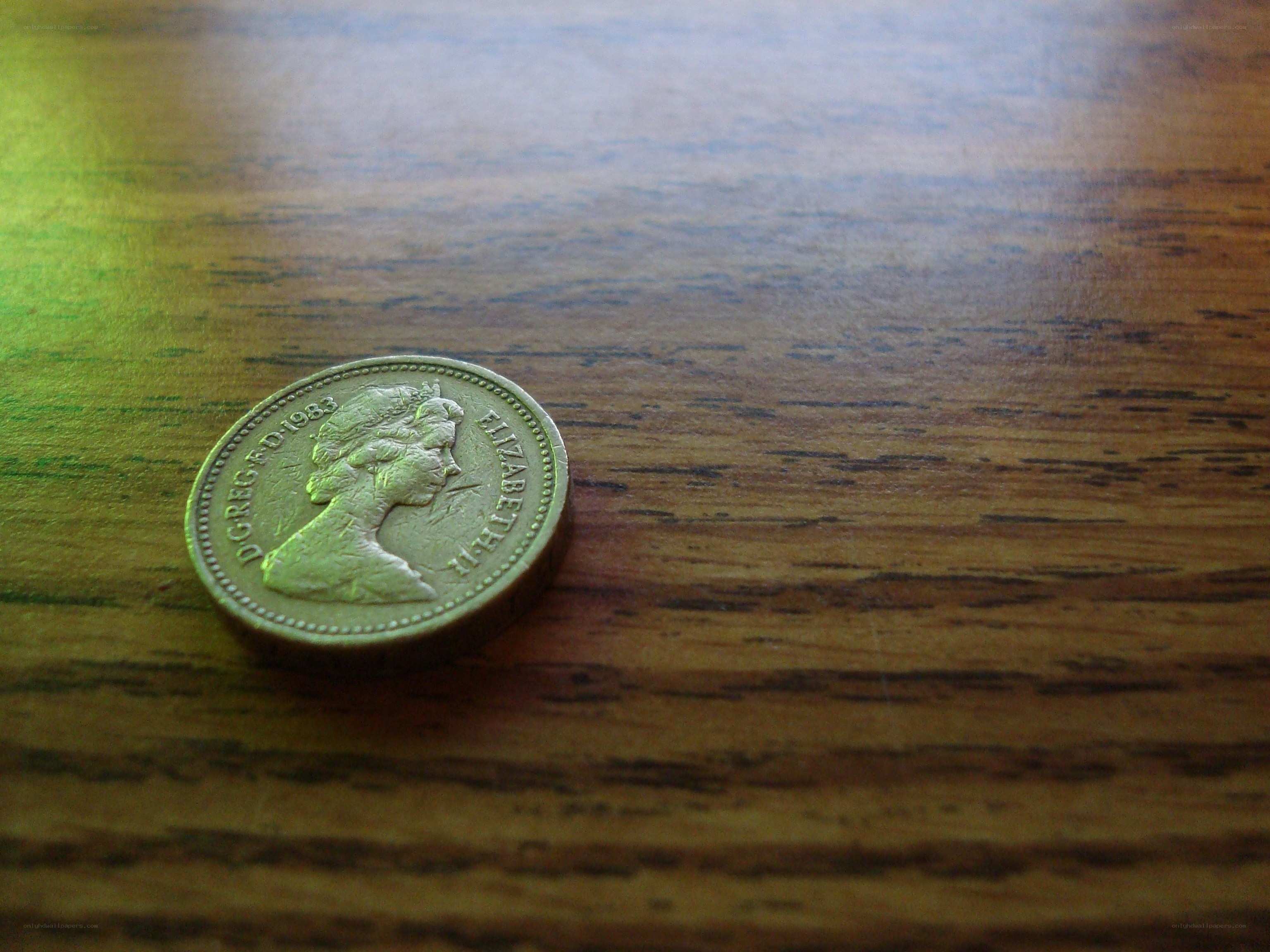 British coin on wooden surface