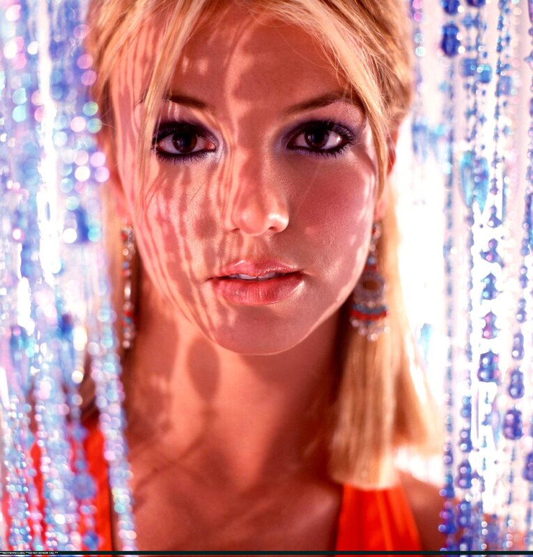 Britney Spears in front of beaded curtain