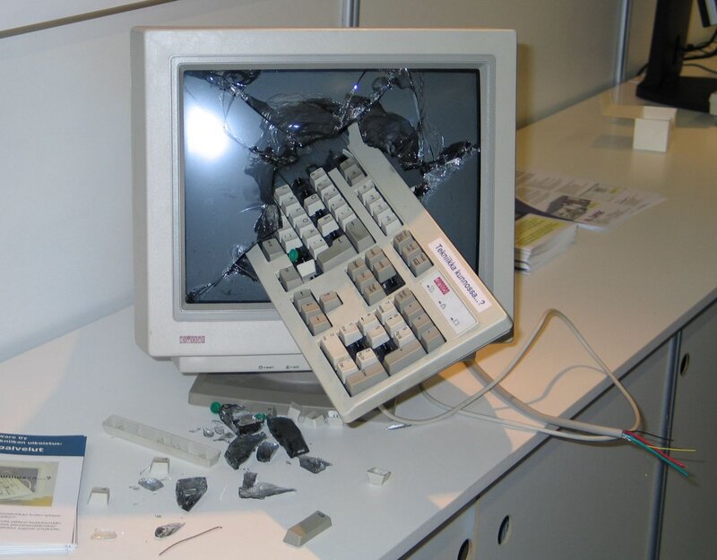 Broken computer monitor and keyboard