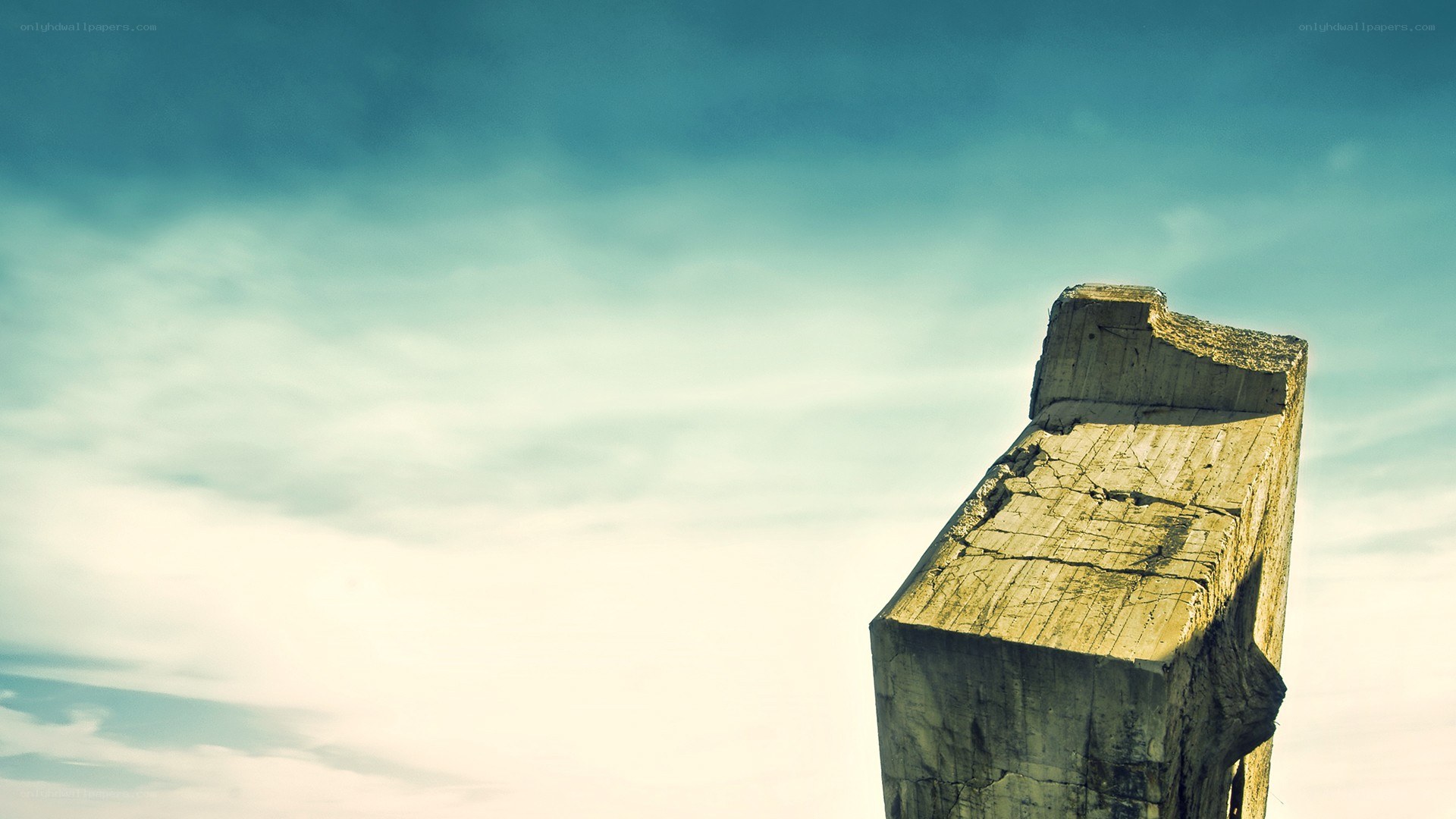 broken concrete pillar against sky