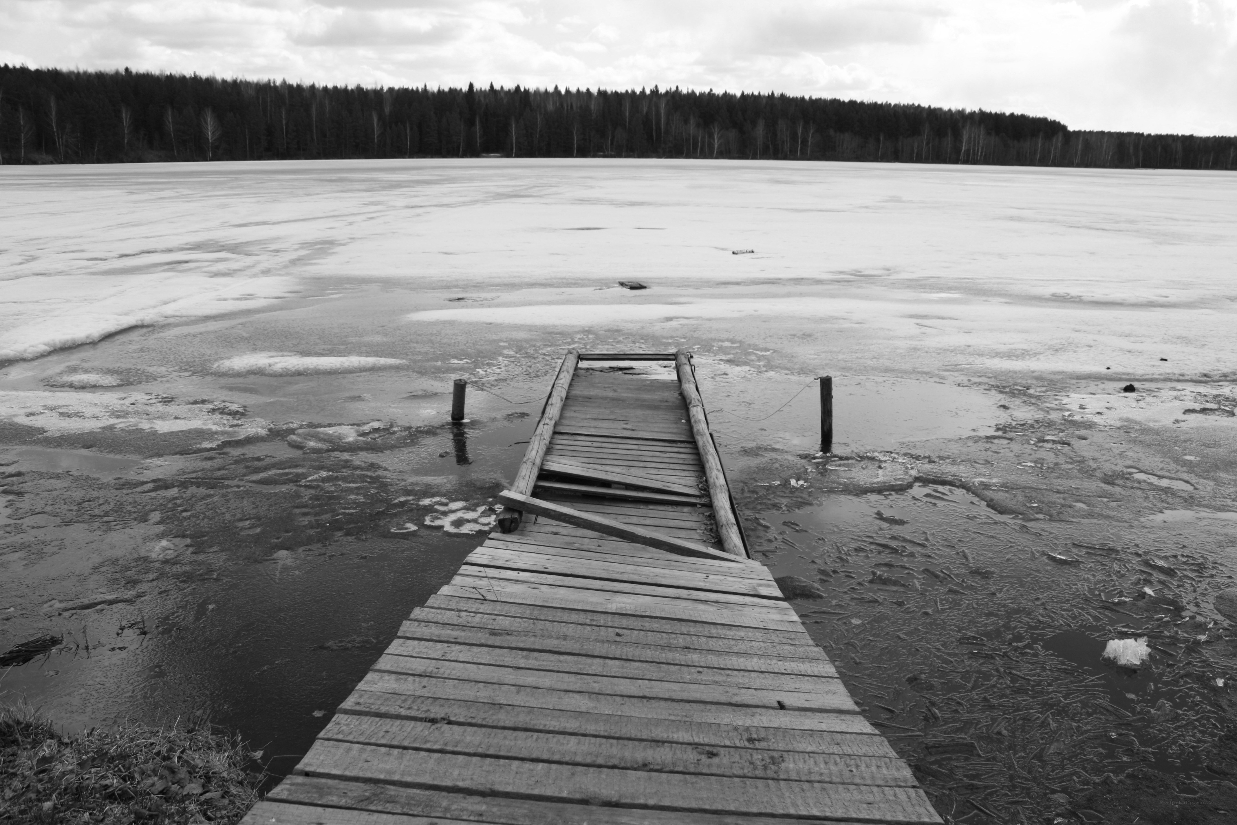 Broken dock on frozen lake
