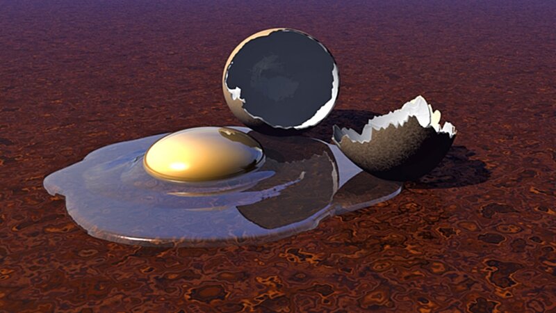 broken egg on red surface