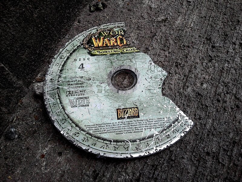 Broken game disc on ground