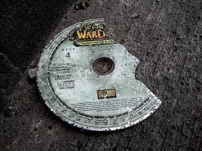 Broken game disc on ground