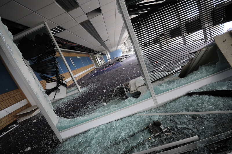 Broken glass in office hallway