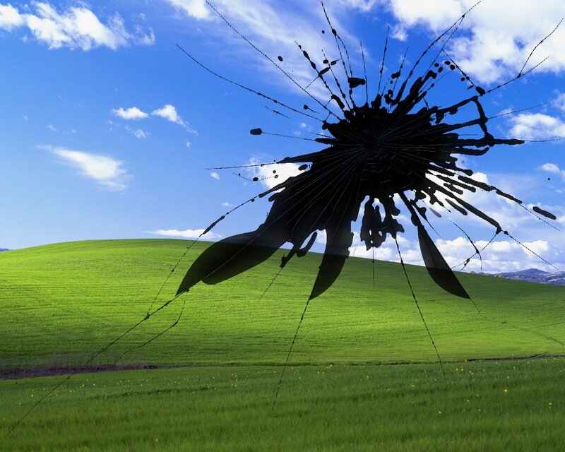 Broken glass on green hills