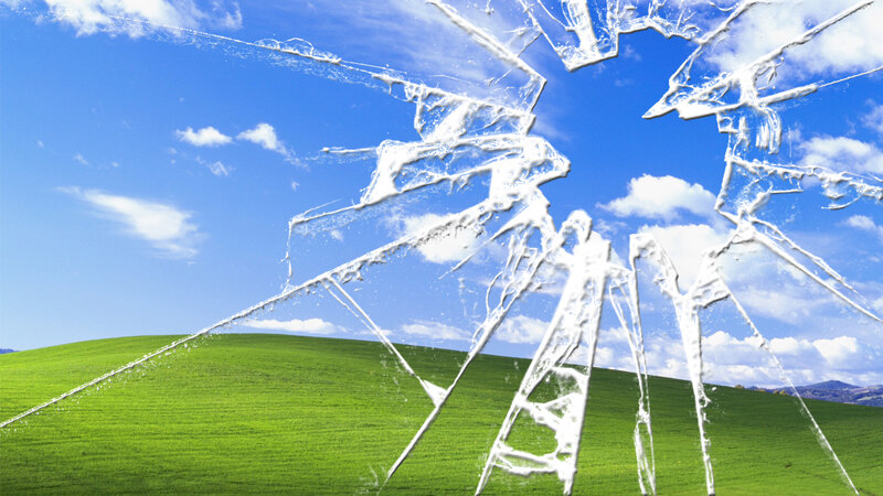 Broken glass over green hills