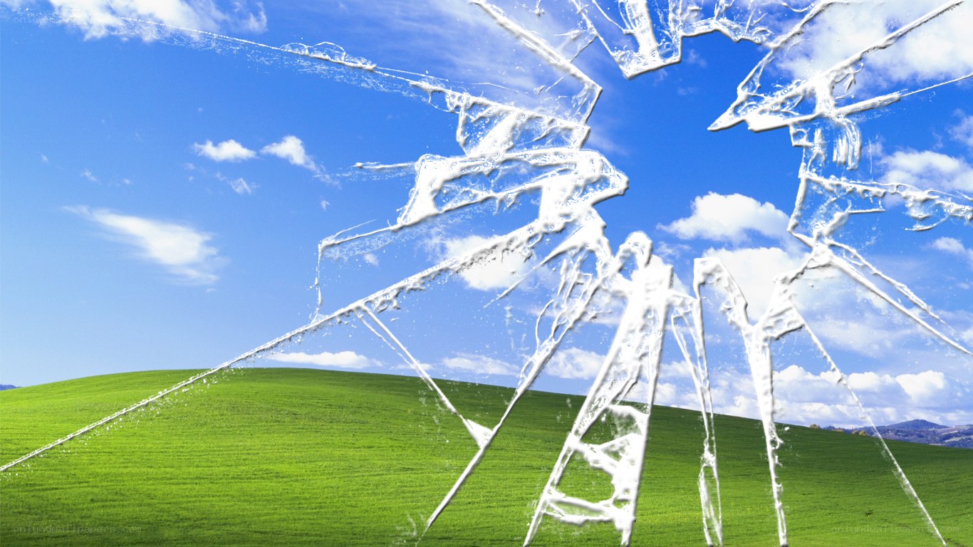 Broken glass over green hills