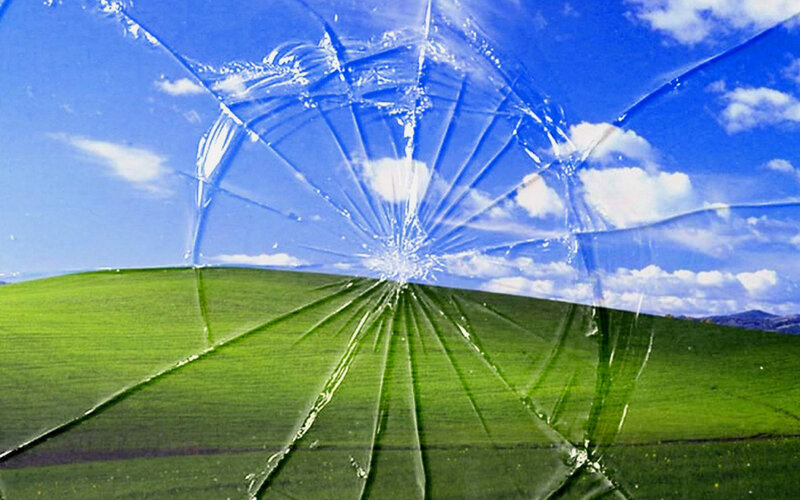 Broken glass over landscape