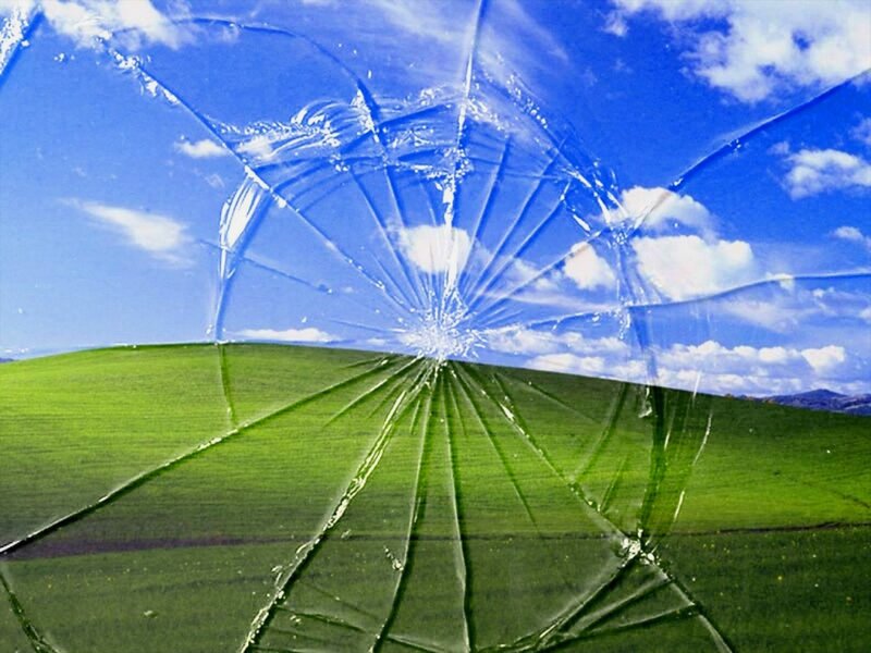 Broken glass over landscape