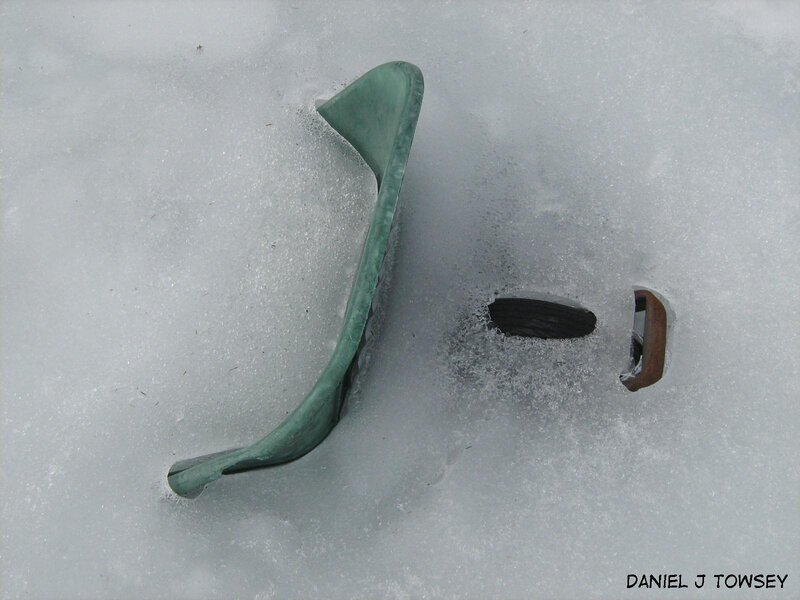 Broken green object in snow