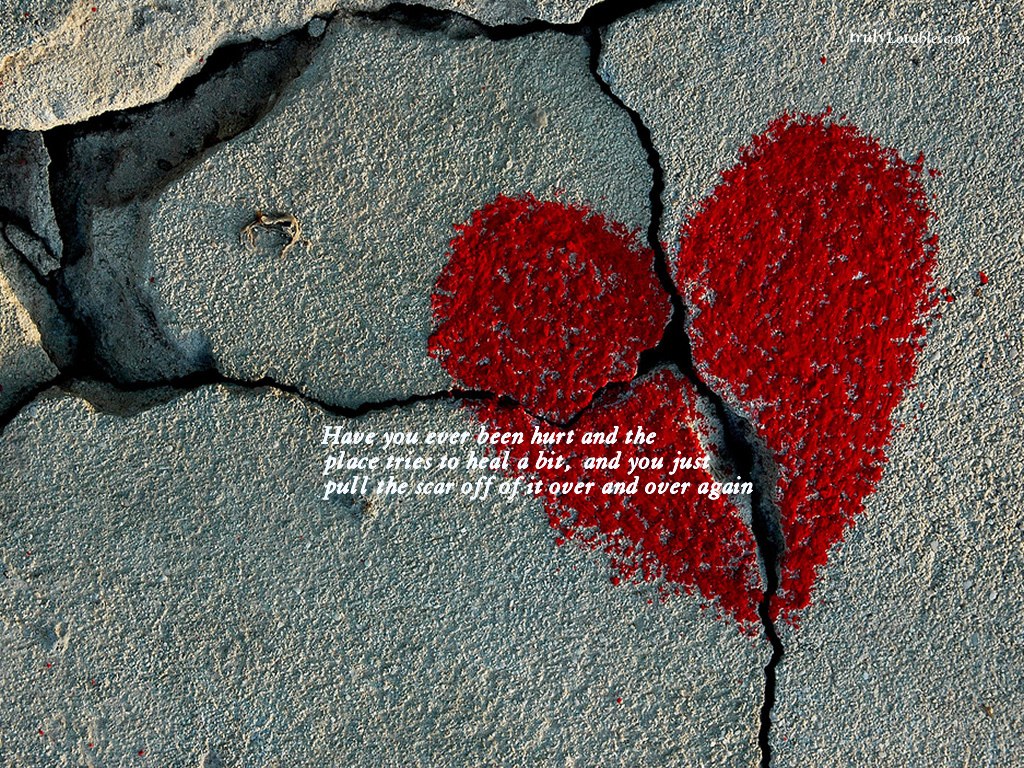 broken heart on cracked concrete