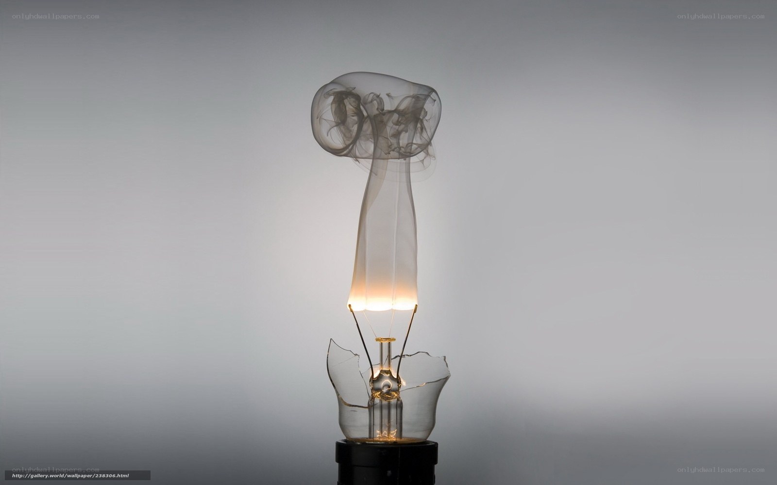 Broken light bulb with smoke