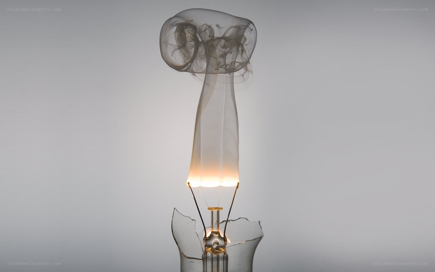 Broken light bulb with smoke