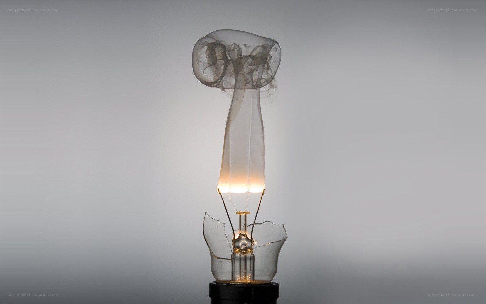 Broken light bulb with smoke