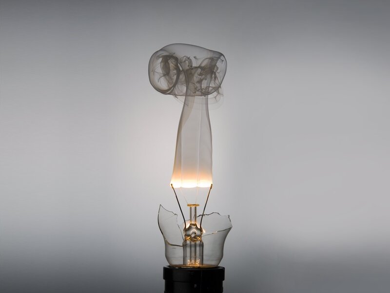 Broken light bulb with smoke