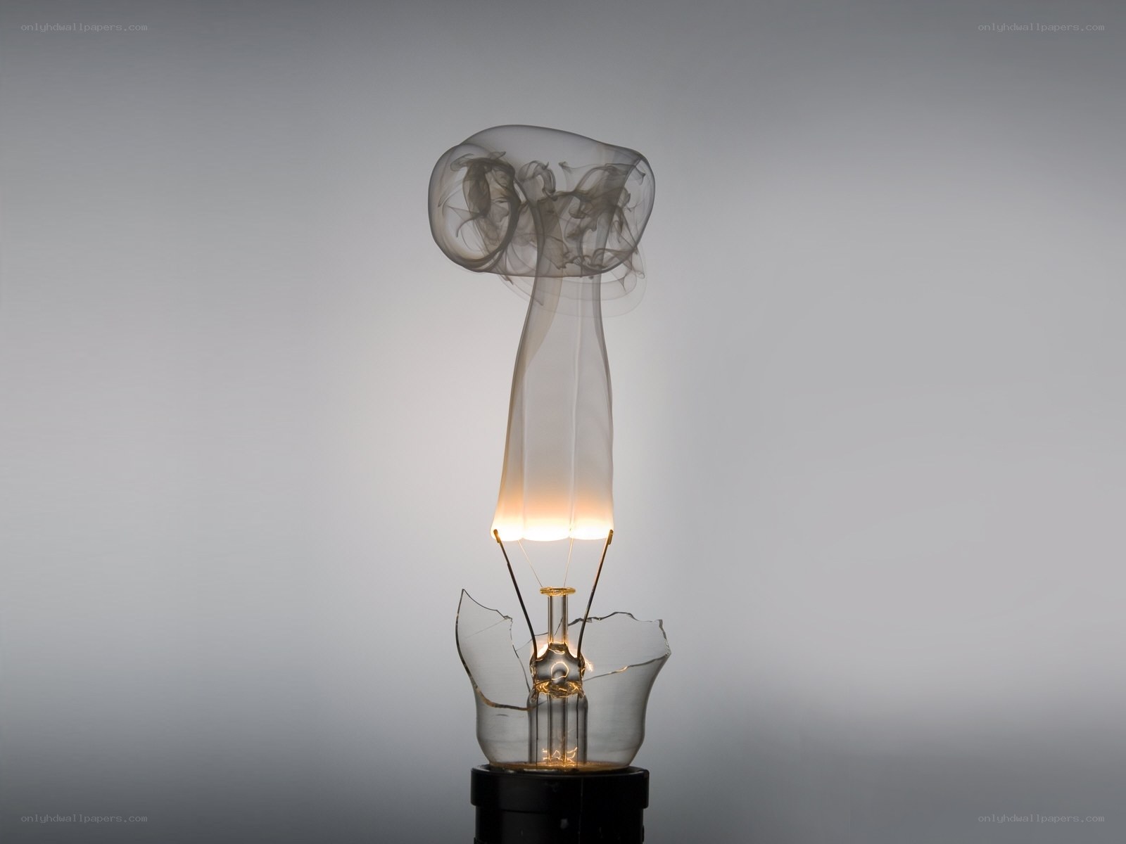 Broken light bulb with smoke