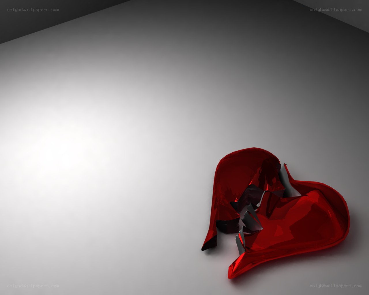 Broken red heart sculpture