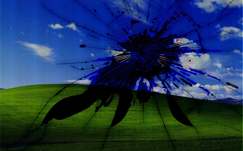 Broken screen with Windows XP wallpaper