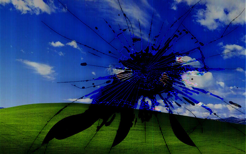 Broken screen with Windows XP wallpaper