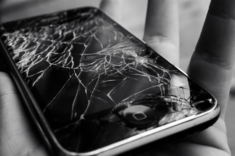 broken smartphone in hand
