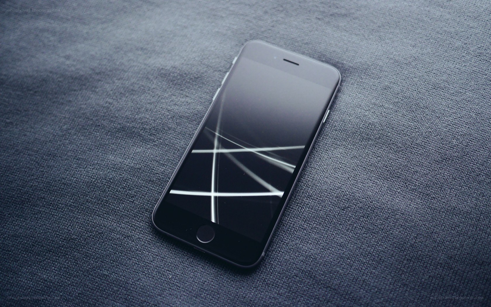 broken smartphone on fabric