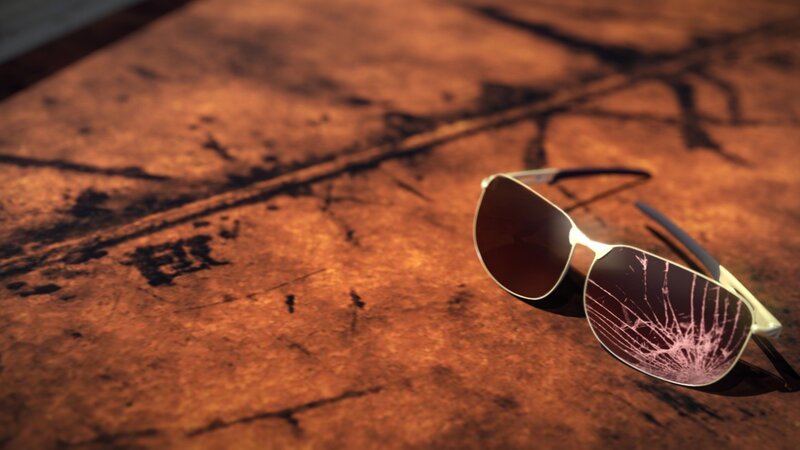Broken sunglasses on a map