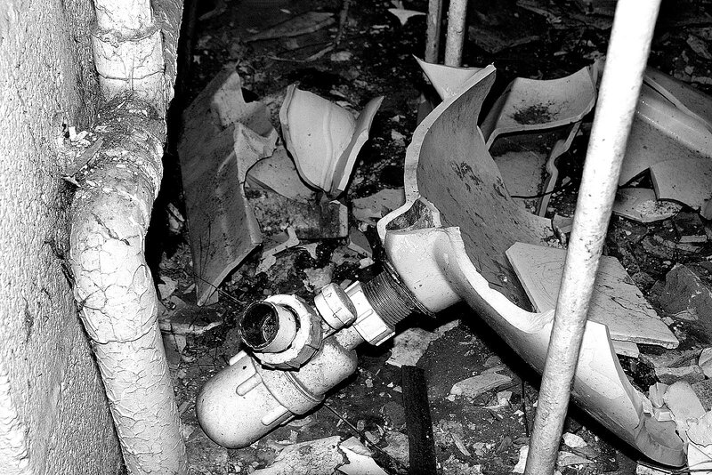 Broken toilet in debris