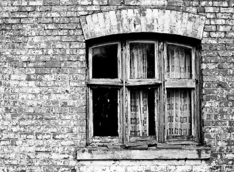 Broken Window in Brick Wall