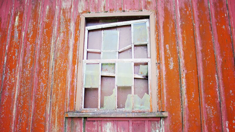 Broken Window on Red Wall