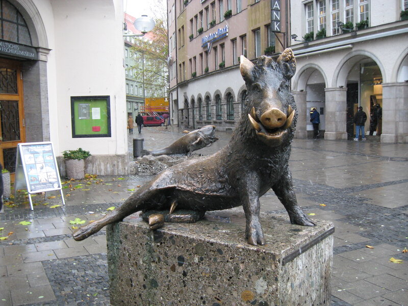 Bronze boar statue in city square