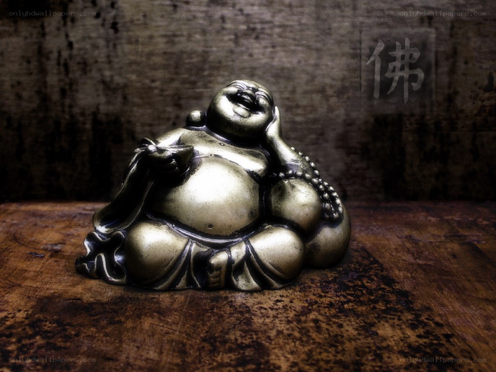 Bronze Buddha statue on wood