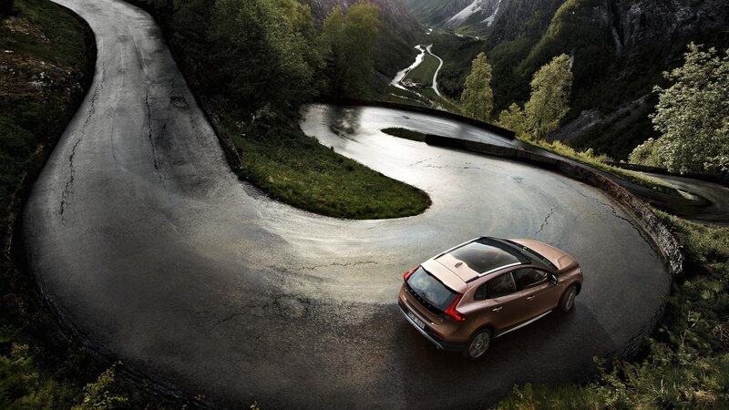 Bronze Car on Winding Road